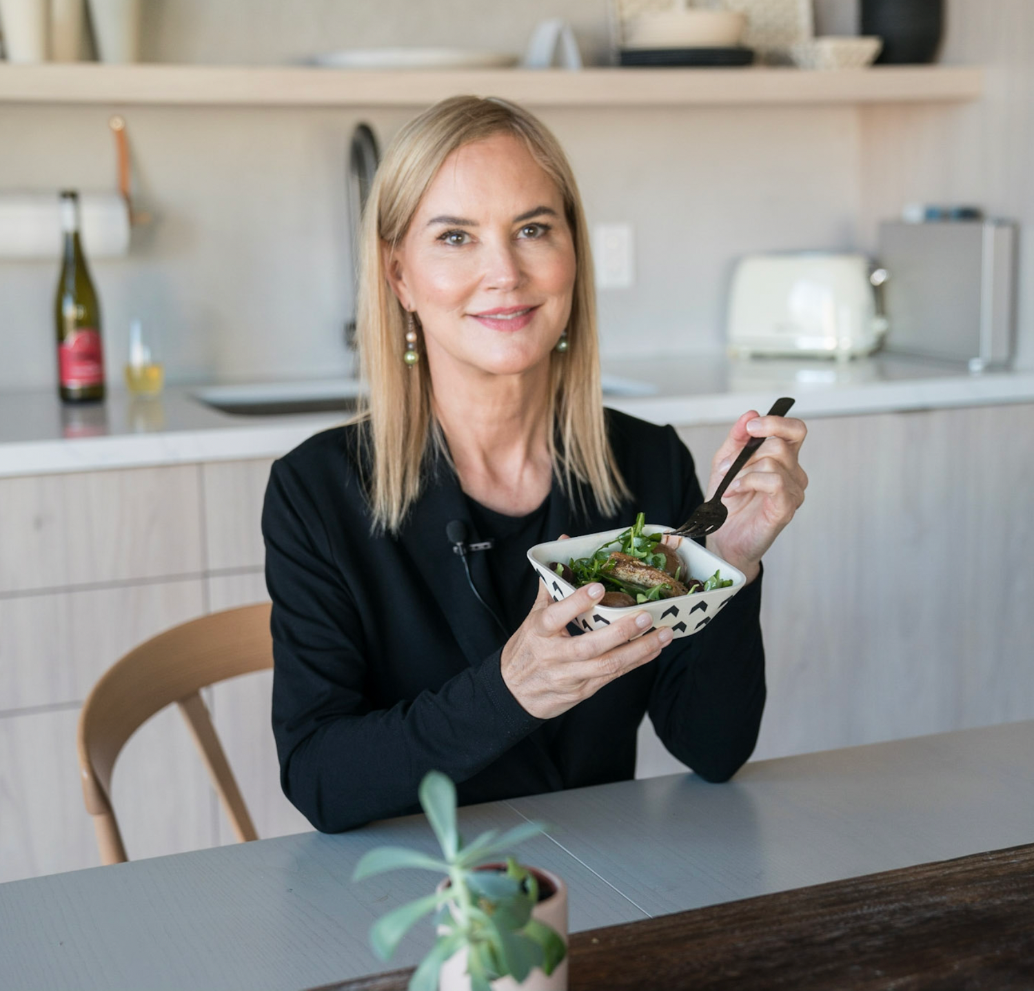 Graydon in the kitchen with a bowl of greens